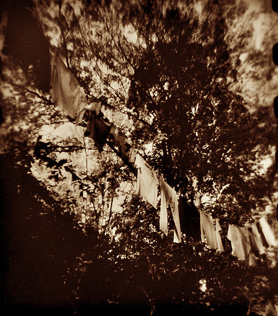 And fasten the clothes to dry, then out in the free fresh air they swing, under the sunny sky.